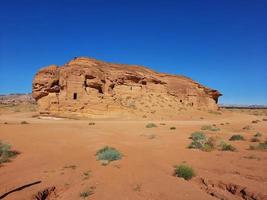 Beautiful daytime view of Al Hegra, Madain Saleh archaeological site in Al Ula, Saudi Arabia. photo