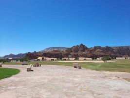 A beautiful daytime view of a winter park in Al Ula, Saudi Arabia. The park is surrounded by ancient hills. photo