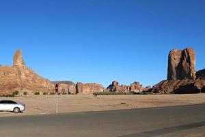 A beautiful daytime view of a winter park in Al Ula, Saudi Arabia. The park is surrounded by ancient hills. photo