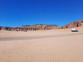 Al Ula, Saudi Arabia, March 2023 - Tourists are in their cars to visit historical sites and archeology in Al Ula, Saudi Arabia. photo