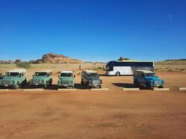 Al Ula, Saudi Arabia, March 2023 - Jeeps are parked at different places in the desert to take tourists to different places during the day in Al Ula, Saudi Arabia. photo