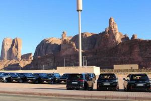 Al Ula, Saudi Arabia, March 2023 - Jeeps are parked at different places in the desert to take tourists to different places during the day in Al Ula, Saudi Arabia. photo