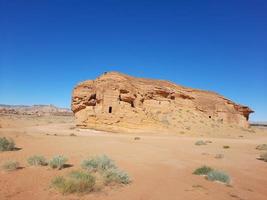 Beautiful daytime view of Al Hegra, Madain Saleh archaeological site in Al Ula, Saudi Arabia. photo