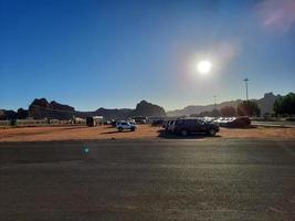 A beautiful daytime view of a winter park in Al Ula, Saudi Arabia. The park is surrounded by ancient hills. photo