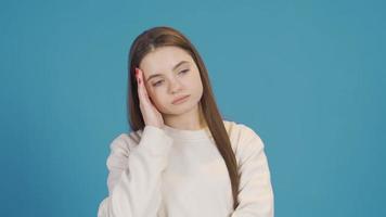 Portrait of thoughtful and confused pensive young woman. Portrait serious face young woman thinks confused and pensive. video