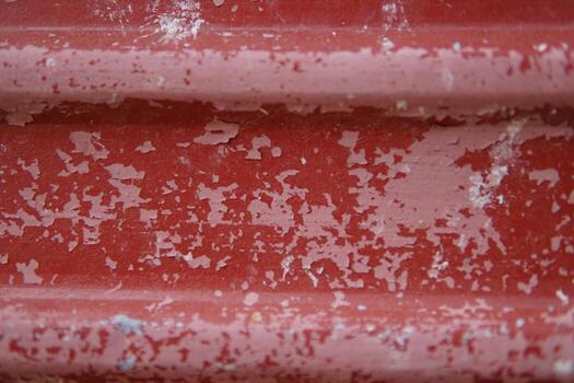 The red background is scratched by age. photo