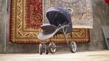 A stroller on the background of a carpet. Close-up. photo