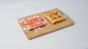 waffle with strawberry and cream on wood plate isolate on white background photo