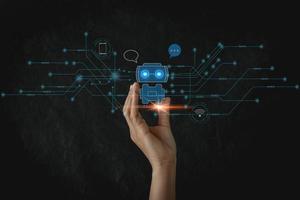 Businesswoman holding a virtual hologram .Hand touching digital chatbot for provide access to information and data in online network, robot application and global connection, conversation AI. photo