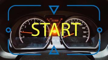 Start concept on a car dashboard with speedometer and warning lights. Ready To Start. photo