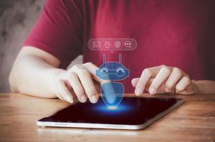 Chatbot concept. robot application and global connection, AI, Artificial intelligence, innovation and technology. Man using tablet with artificial intelligence concept. photo