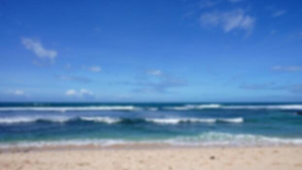 Blurred background photo of a white sand beach on the island of Java