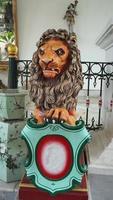 The statue of a lion in the Yogyakarta Palace symbolizes the royal power of the palace in Java photo