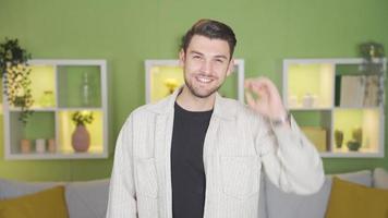 Young happy man looking confident looking at camera. Young happy man smiling confidently looking at camera. video