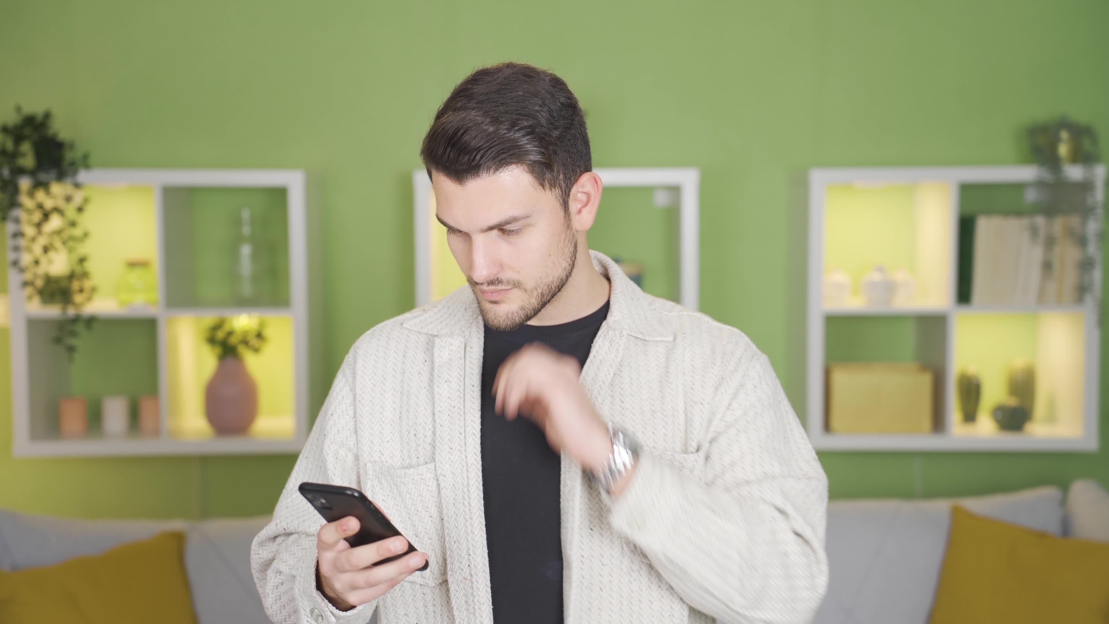 Young man making phone call at home. Young man talking on the phone