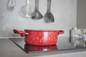 cooking pan on electric stove, electric stove is heated to red. photo