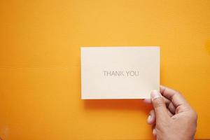 man hand reading a thank you letter photo