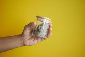 Dry tea leaves in a jar photo