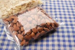 Close up of almond nut in a plastic packet photo