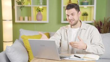 Young man looking at camera happy and smiling and telling something. video