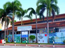 A building and palm trees photo