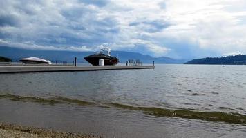 lake mountain landscape, cloudy, boats on lake video