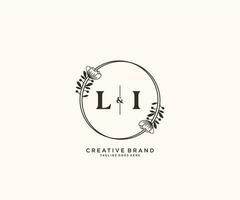 initial LI letters hand drawn feminine and floral botanical logo suitable for spa salon skin hair beauty boutique and cosmetic company. vector