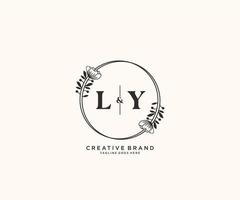 initial LY letters hand drawn feminine and floral botanical logo suitable for spa salon skin hair beauty boutique and cosmetic company. vector