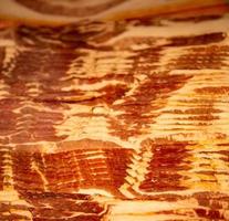 Row of Uncooked Bacon photo