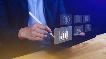 Big data analytics and business intelligence BI concept with chart and graph icons on digital screen interface and business people in the background. photo