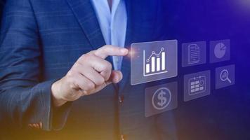 Big data analytics and business intelligence BI concept with chart and graph icons on digital screen interface and business people in the background. photo