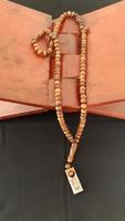 Tasbih lying on a folding table to recite the Quran. Islamic concept photo