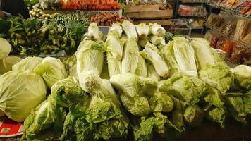 Chicory neatly arranged on a shelf for sale in traditional markets. photo