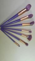 A set of purple makeup brushes for makeup. photo