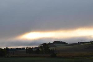 weird line in the clouds during sunrise photo