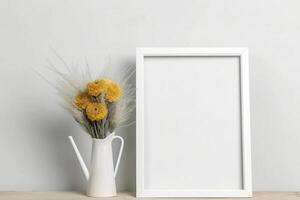 Frame mockup with yellow flowers on the table, created with photo