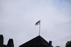 old flag on a tower photo