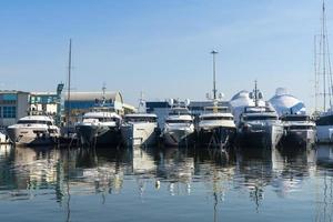Luxury boats moored in sea port photo