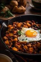 Traditional American hash with fried eggs. photo