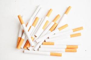 Cigarette isolated on white background with clipping path, roll tobacco in paper with filter tube, No smoking concept. photo
