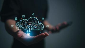 Businesswoman with cloud computing diagram show on hand. Cloud technology. Data storage. Networking and internet service concept. photo