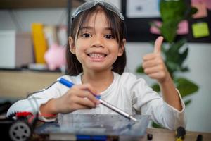 Asia students learn at home in coding robot cars and electronic board cables in STEM, STEAM, photo