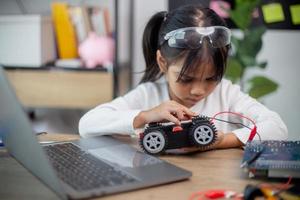 Asia students learn at home in coding robot cars and electronic board cables in STEM, STEAM, photo