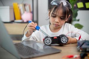 Asia students learn at home in coding robot cars and electronic board cables in STEM, STEAM, photo