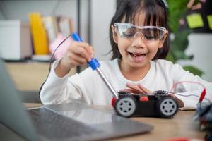 Asia students learn at home in coding robot cars and electronic board cables in STEM, STEAM, photo