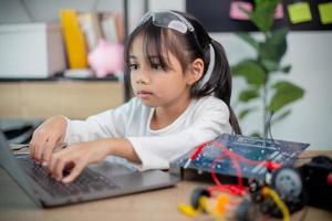 Asia students learn at home in coding robot cars and electronic board cables in STEM, STEAM, photo