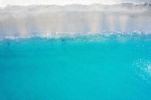 Beautiful turquoise sea and wave on the beach in sunny day photo
