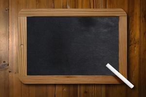 Blackboard with copy space on a desk photo