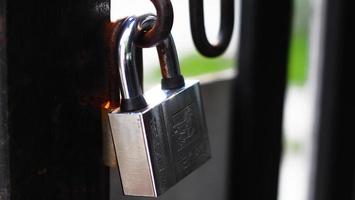 close up of a black and white photo of a closed lock with the inscription on the background,key images