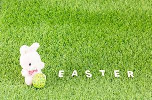 Bunny toy and Easter eggs with text photo